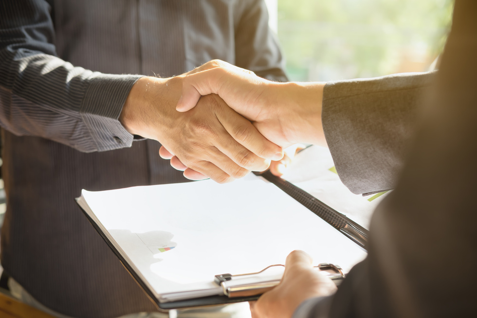 Handshake Over a Contract Agreement